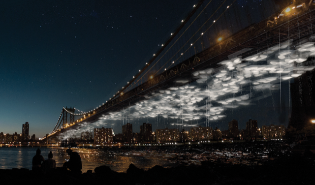 海外の夜の橋の写真。川にかかった橋の底面には白く光るインスタレーションがぶら下がっている